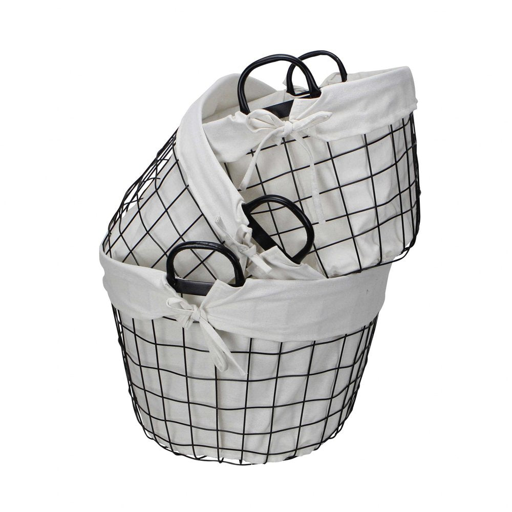 Set Of Three Black Oval Wire Baskets with White Fabric Liners and Handles on a white background