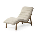 A cream fabric tufted lounge chair with a wooden frame on a white background.
