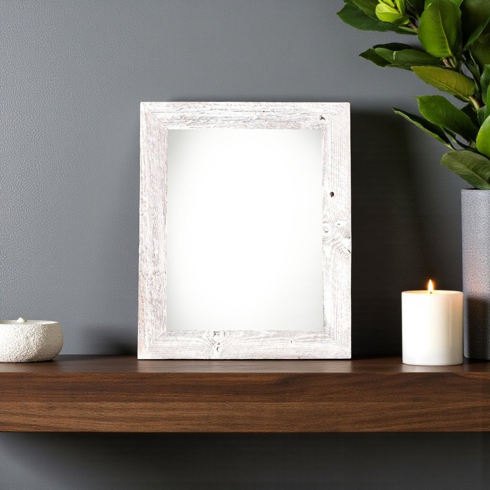 5" x 7" White Solid Wood Tabletop Picture Frame styled in a furnished interior with a gray wall on a black floor.