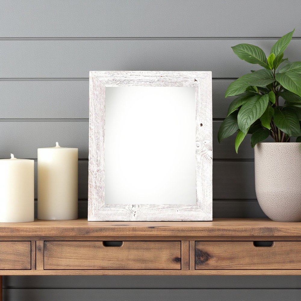 6" x 6" White Solid Wood Tabletop Picture Frame styled in a furnished interior with a light gray wall on a charcoal floor.
