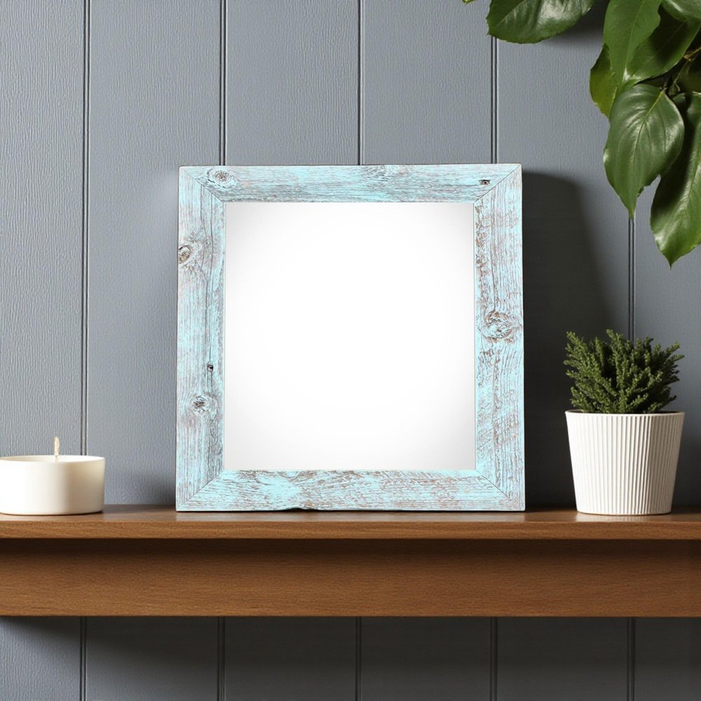 6" x 6" Blue Solid Wood Tabletop Picture Frame styled in a furnished interior with a gray wall on a charcoal floor.