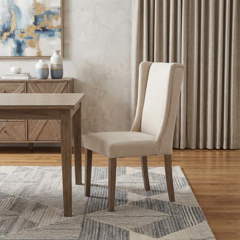 Tufted Cream and Brown Upholstered Linen Wing Back Dining Side Chair in a home interior