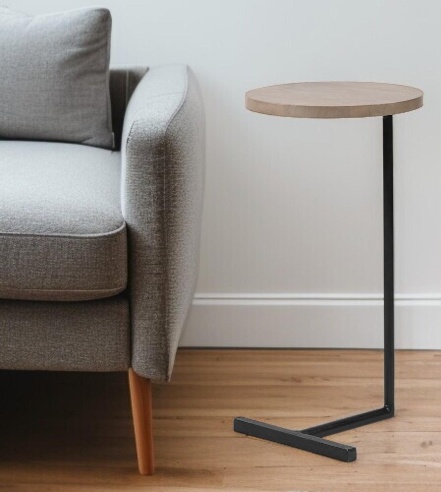 15" Natural and Black Solid Wood and Metal styled in a furnished interior with an off-white wall on a wood floor.