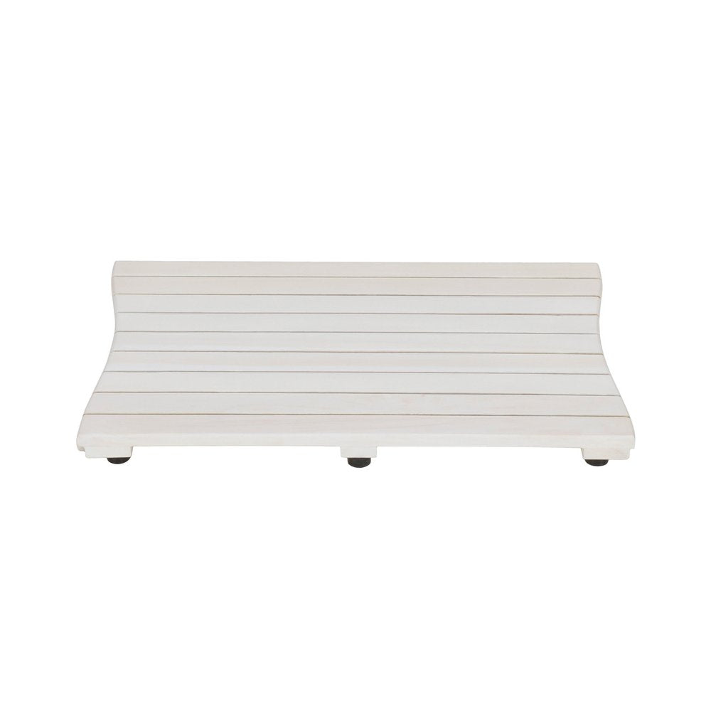White teak slat bath mat with curved edges and black non-slip feet on a white background.
