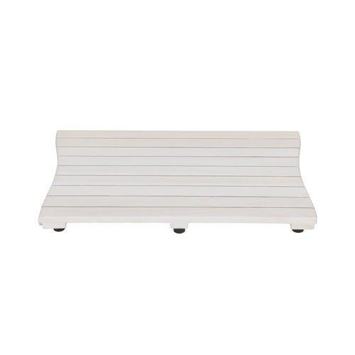White teak slat bath mat with curved edges and black non-slip feet on a white background.