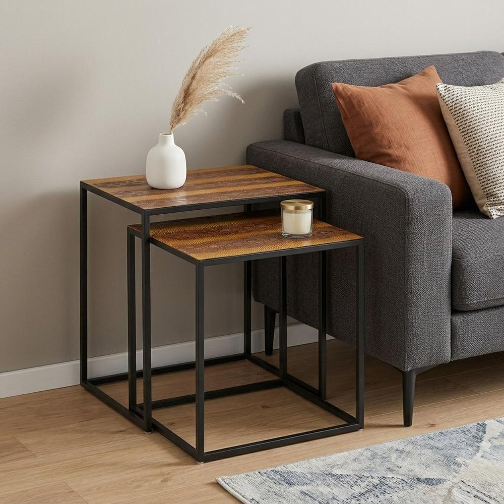 Set of Two Brown and Black Metal And Faux Snake Leather Nesting End Tables in a home interior