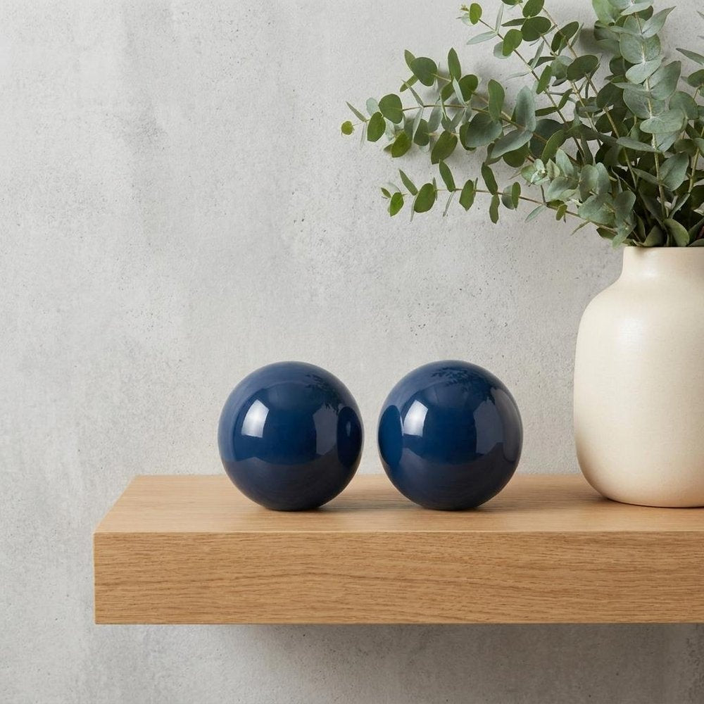 Set of Two Yellow Aluminum Decorative Orbs in a home interior
