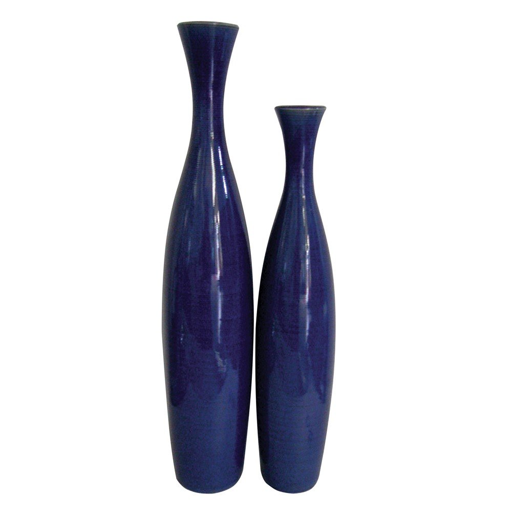Two tall, slender cobalt blue ceramic vases with narrow necks on a white background.