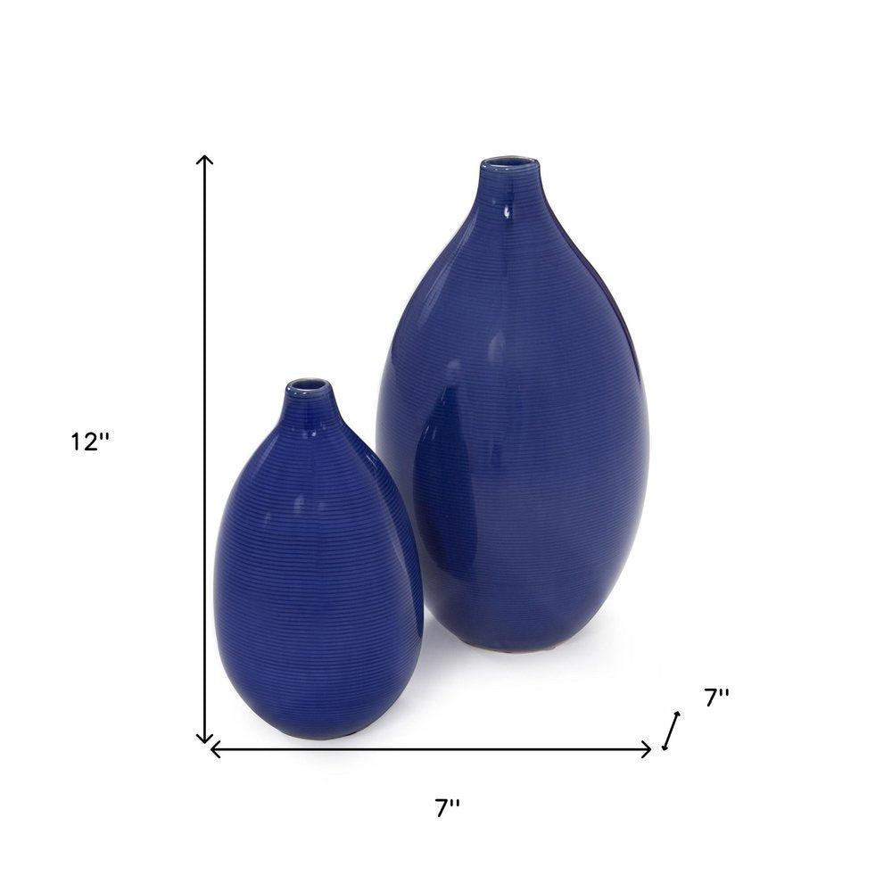 Set of Two Cobalt Ceramic Round Table Vases on a white background
