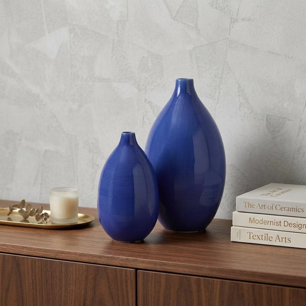 Set of Two Cobalt Ceramic Round Table Vases in a home interior