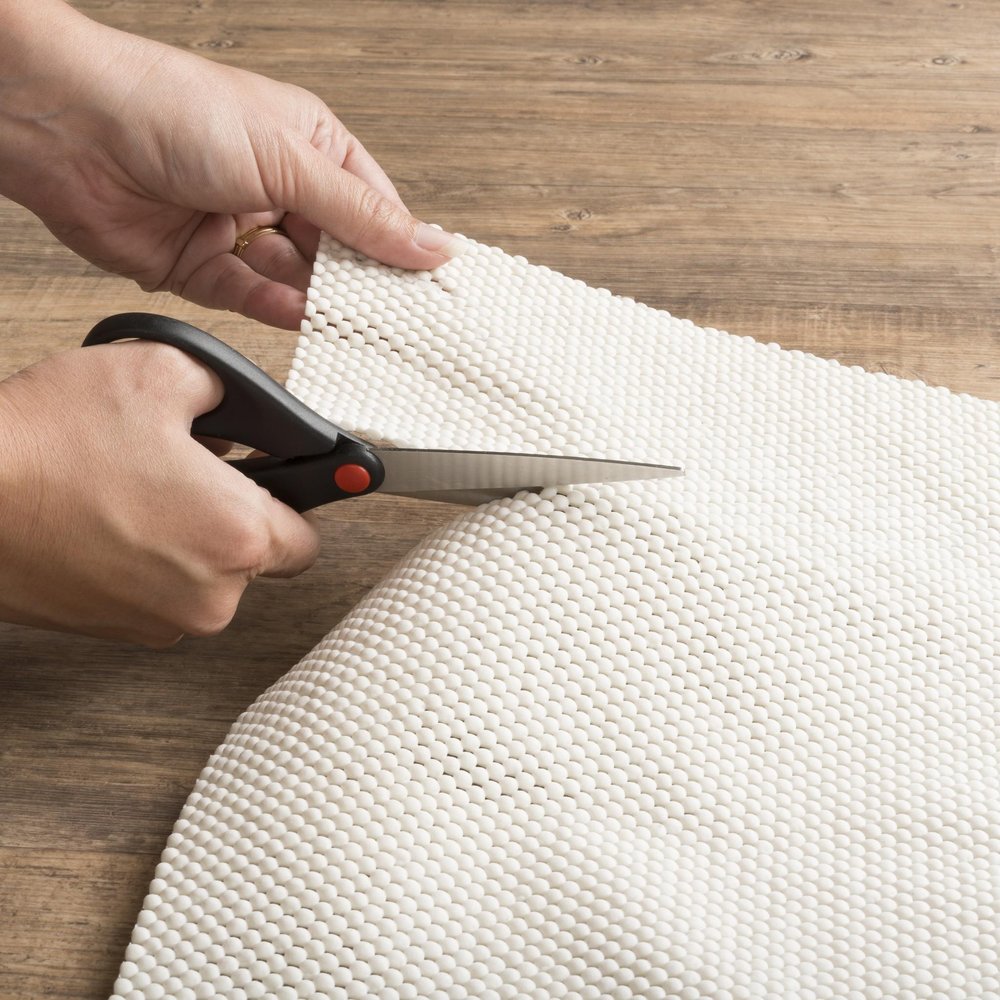 8' Round Beige Non Slip Rug Pad in a home interior