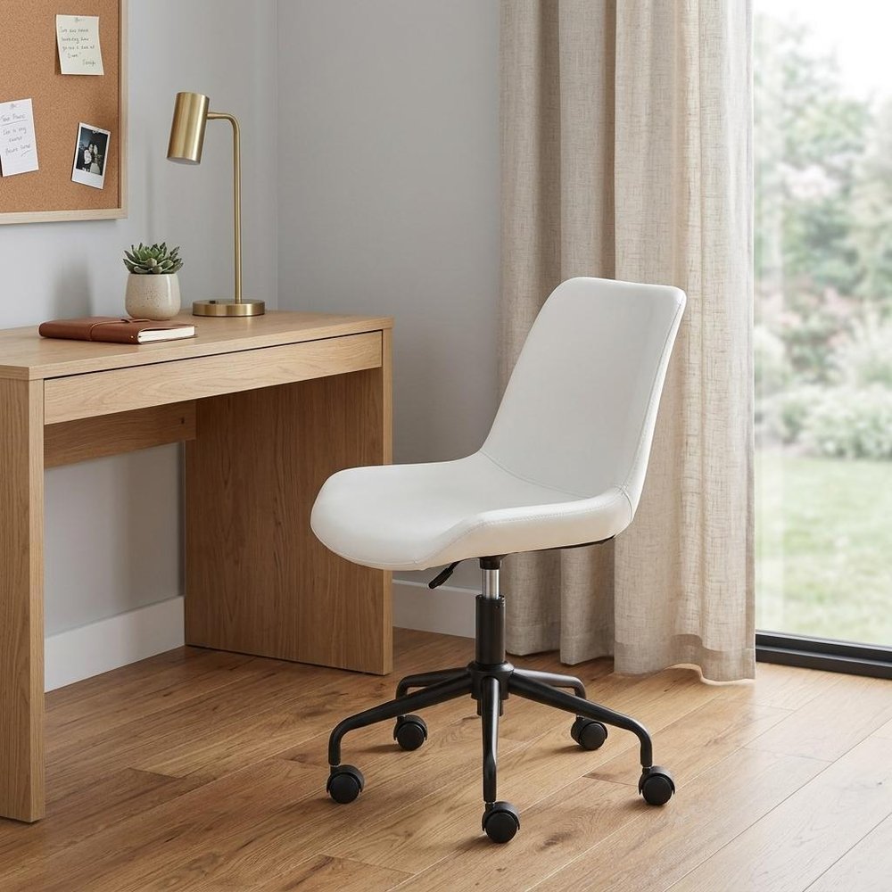 White and Black Adjustable Swivel Faux Leather Rolling Office Chair in a home interior
