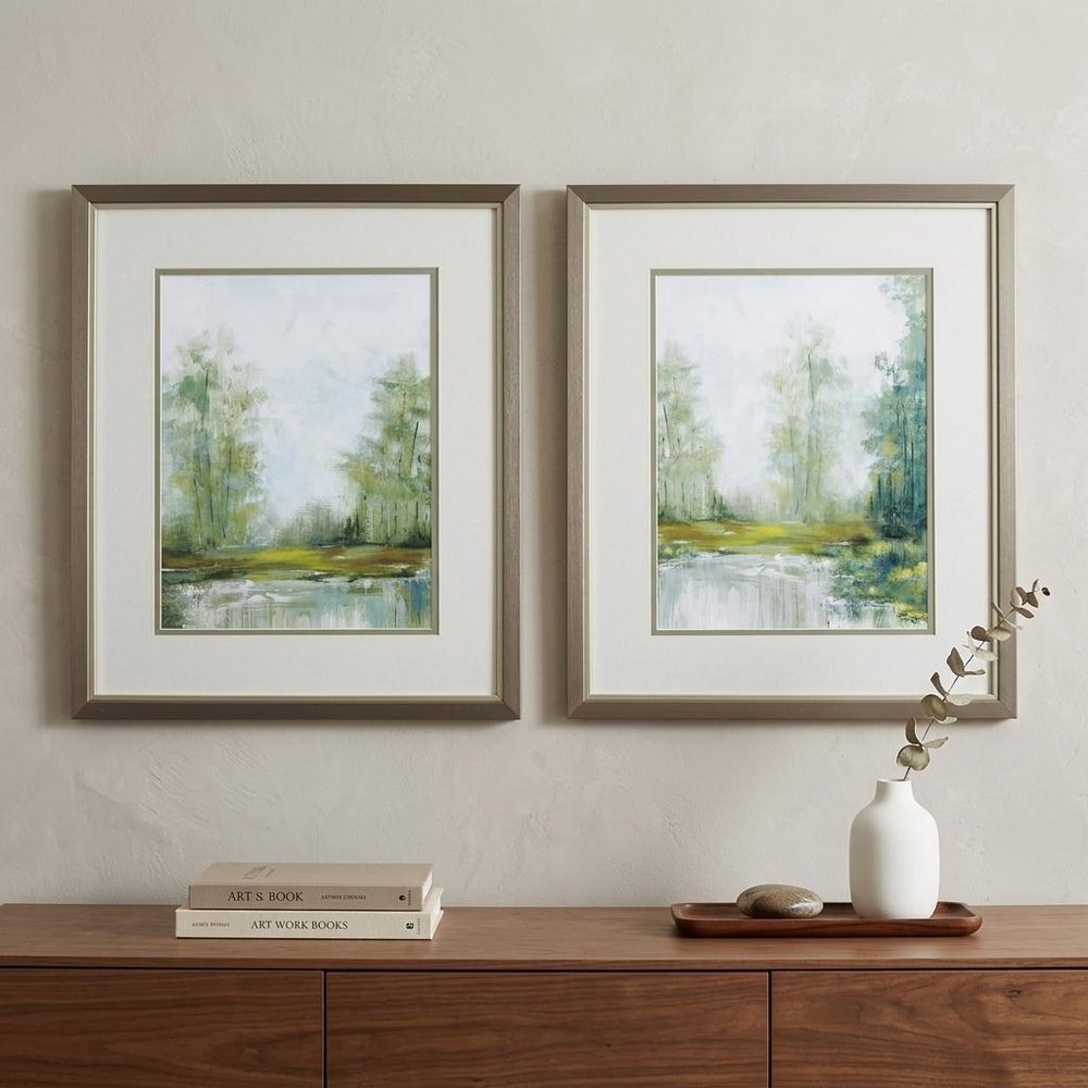 Set of Two Green Forest Landscapes Framed Wall Art in a home interior