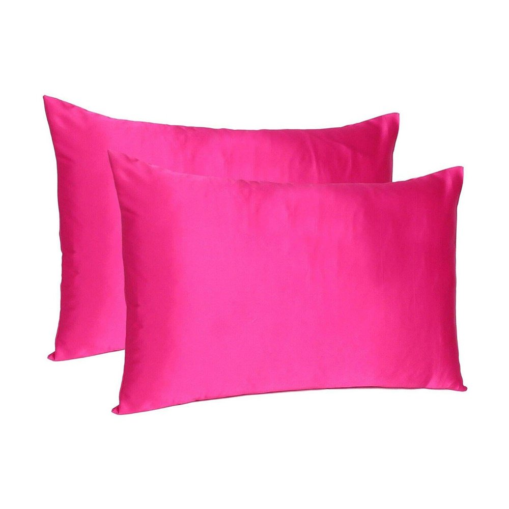 Two fuchsia satin pillowcases with envelope closure on a white background.