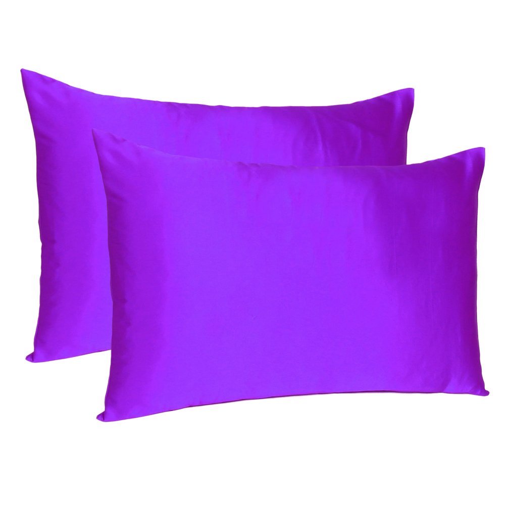 Two bright purple silky satin queen pillowcases on a white background.