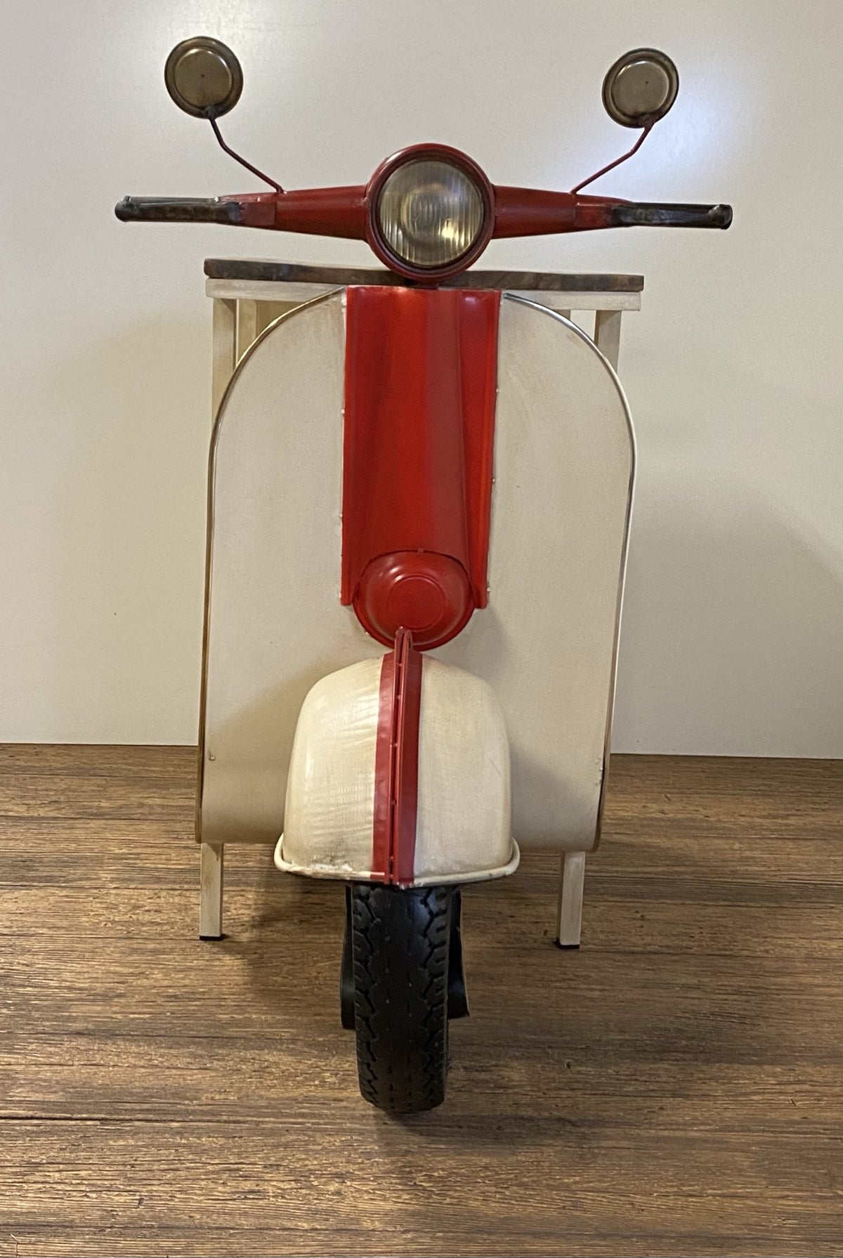 Rustic Red And Vanilla Scooter Cabinet in a home interior