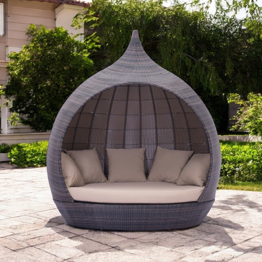 Teardrop Shaped Brown and Beige Daybed in a home interior