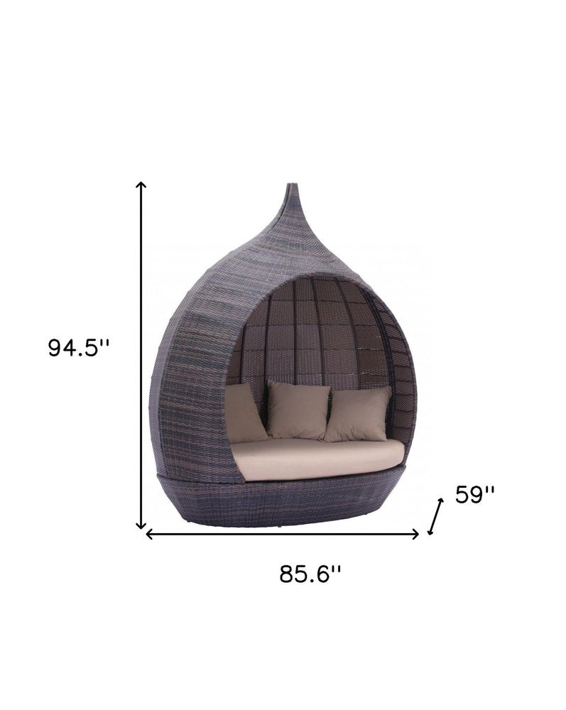 Teardrop Shaped Brown and Beige Daybed on a white background