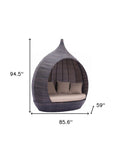 Teardrop Shaped Brown and Beige Daybed on a white background