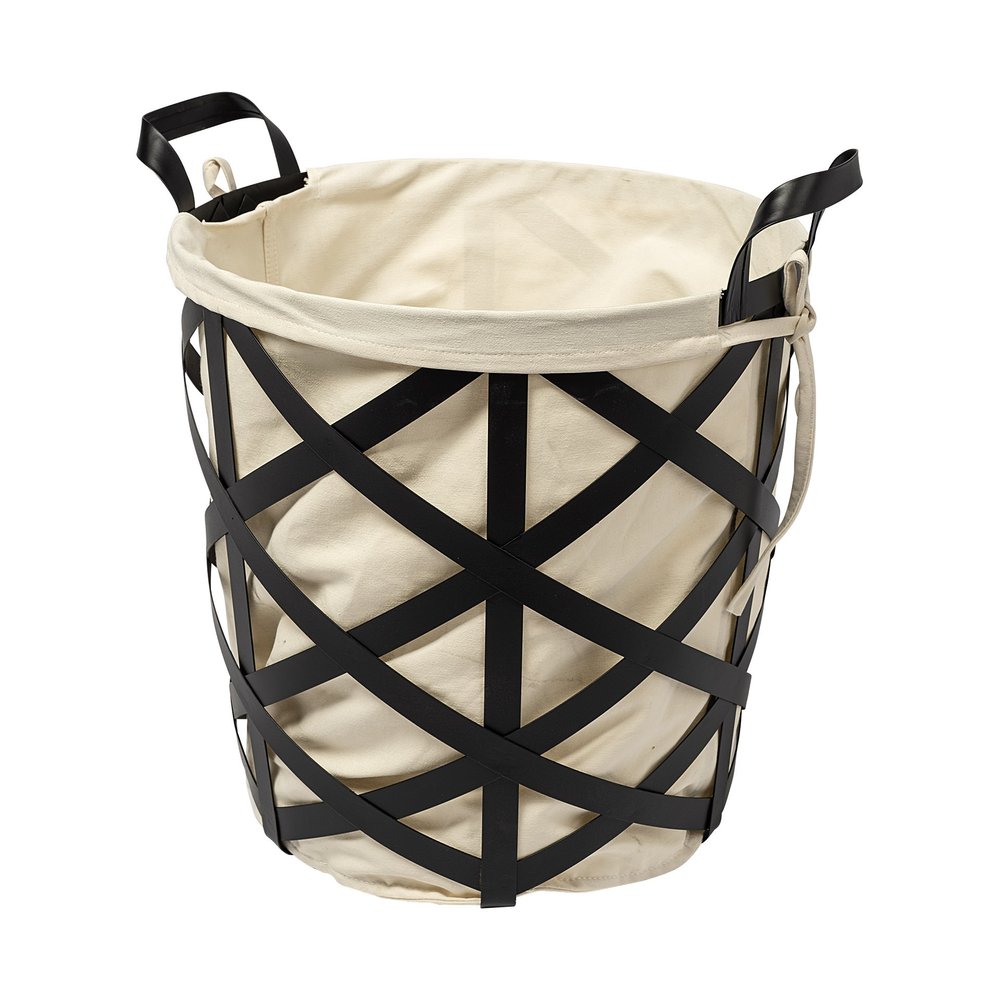 Cream canvas laundry basket with black metal lattice exterior and black handles on a white background.