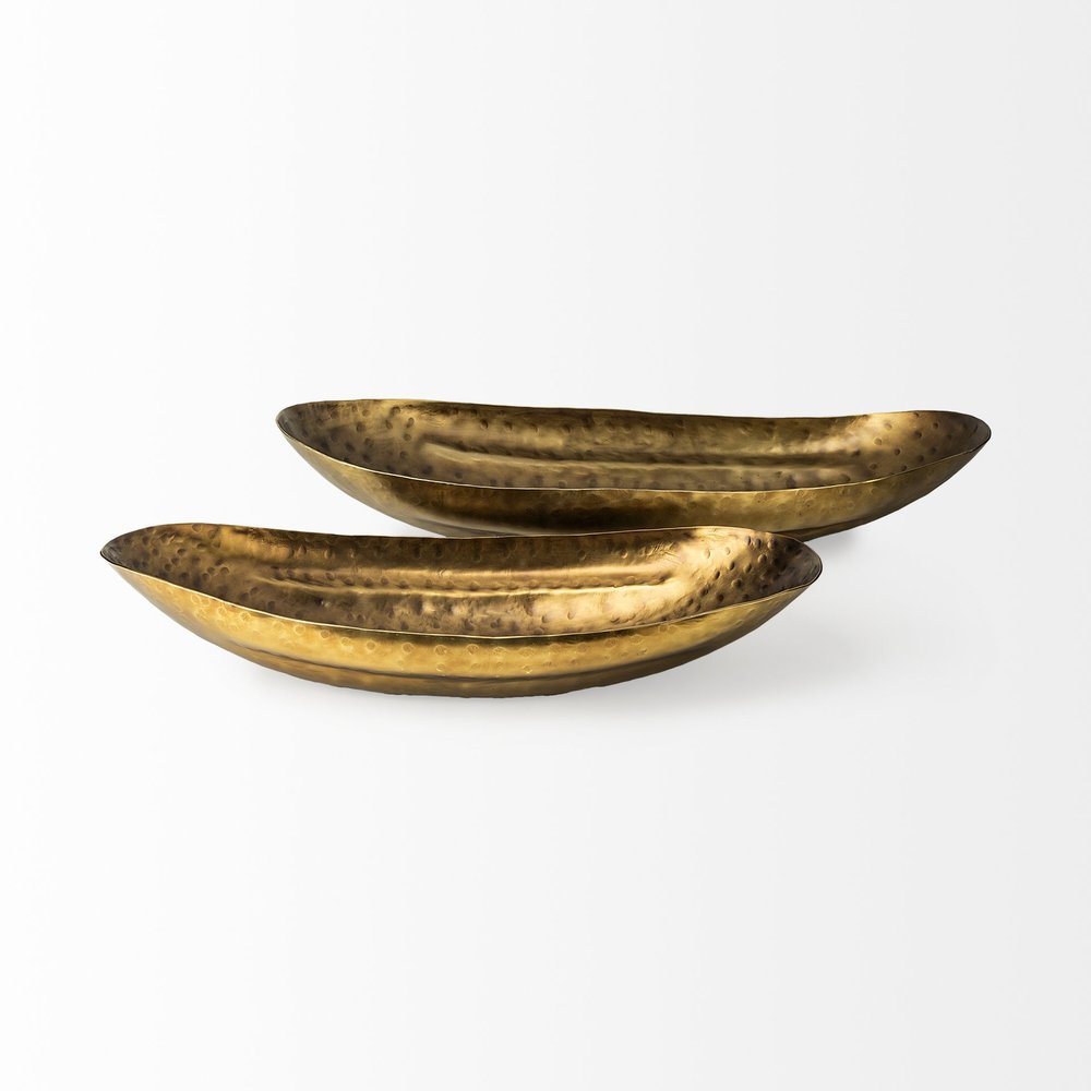 Set of Two Gold Hammered Metal Boat Shaped Decorative Bowls on a white background