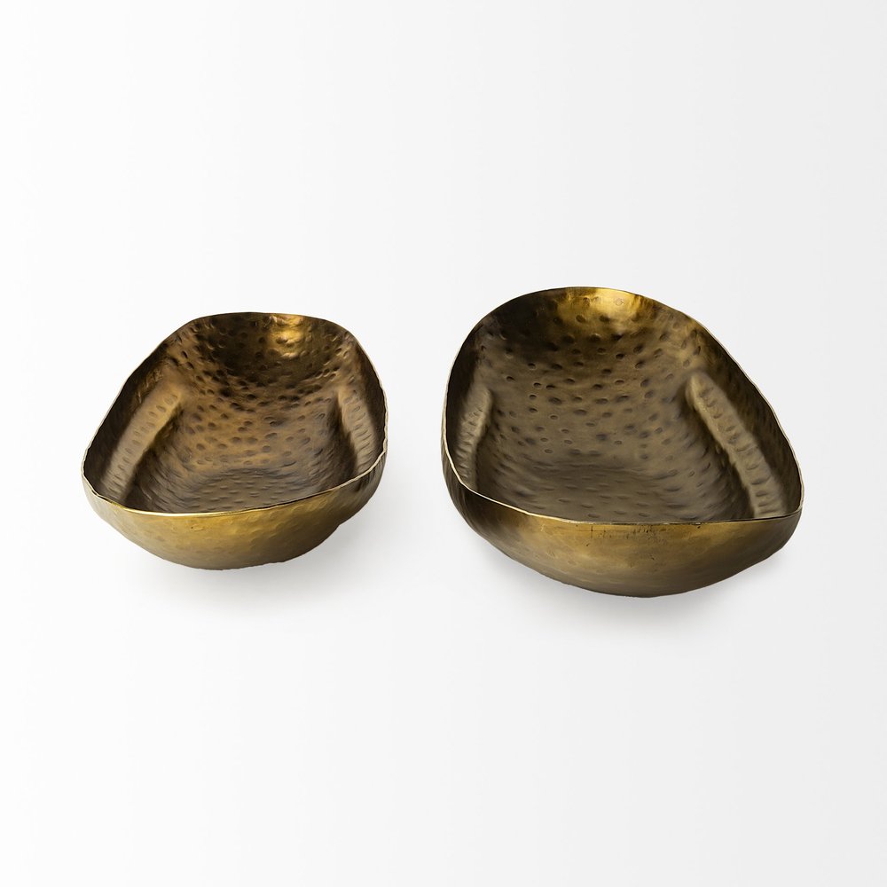 Set of Two Gold Hammered Metal Boat Shaped Decorative Bowls on a white background