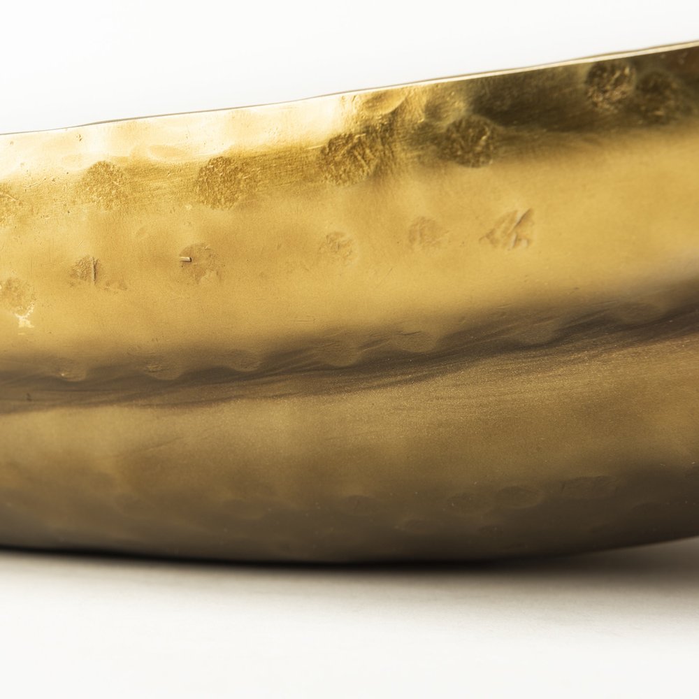 Set of Two Gold Hammered Metal Boat Shaped Decorative Bowls on a white background