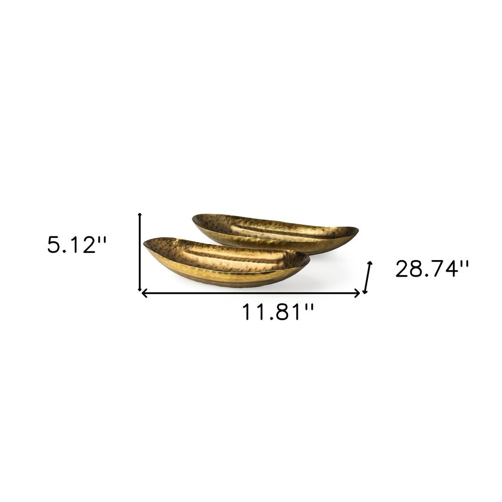 Set of Two Gold Hammered Metal Boat Shaped Decorative Bowls on a white background