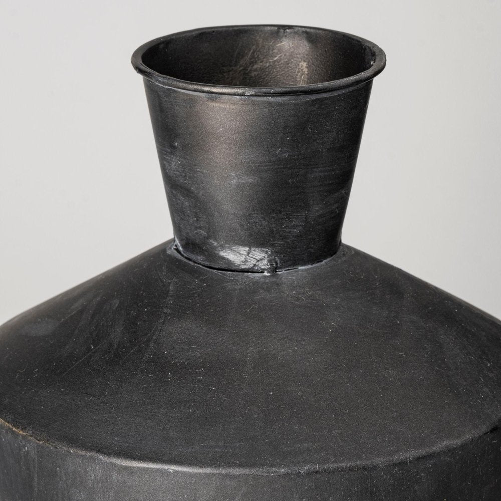 Set of Two Black and Brown Metal Cylindrical Urns in a home interior