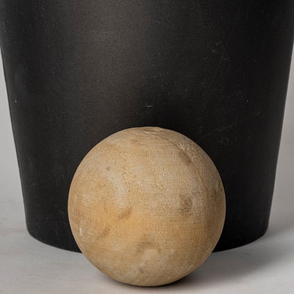 Set of Two Black and Brown Metal Cylindrical Urns in a home interior