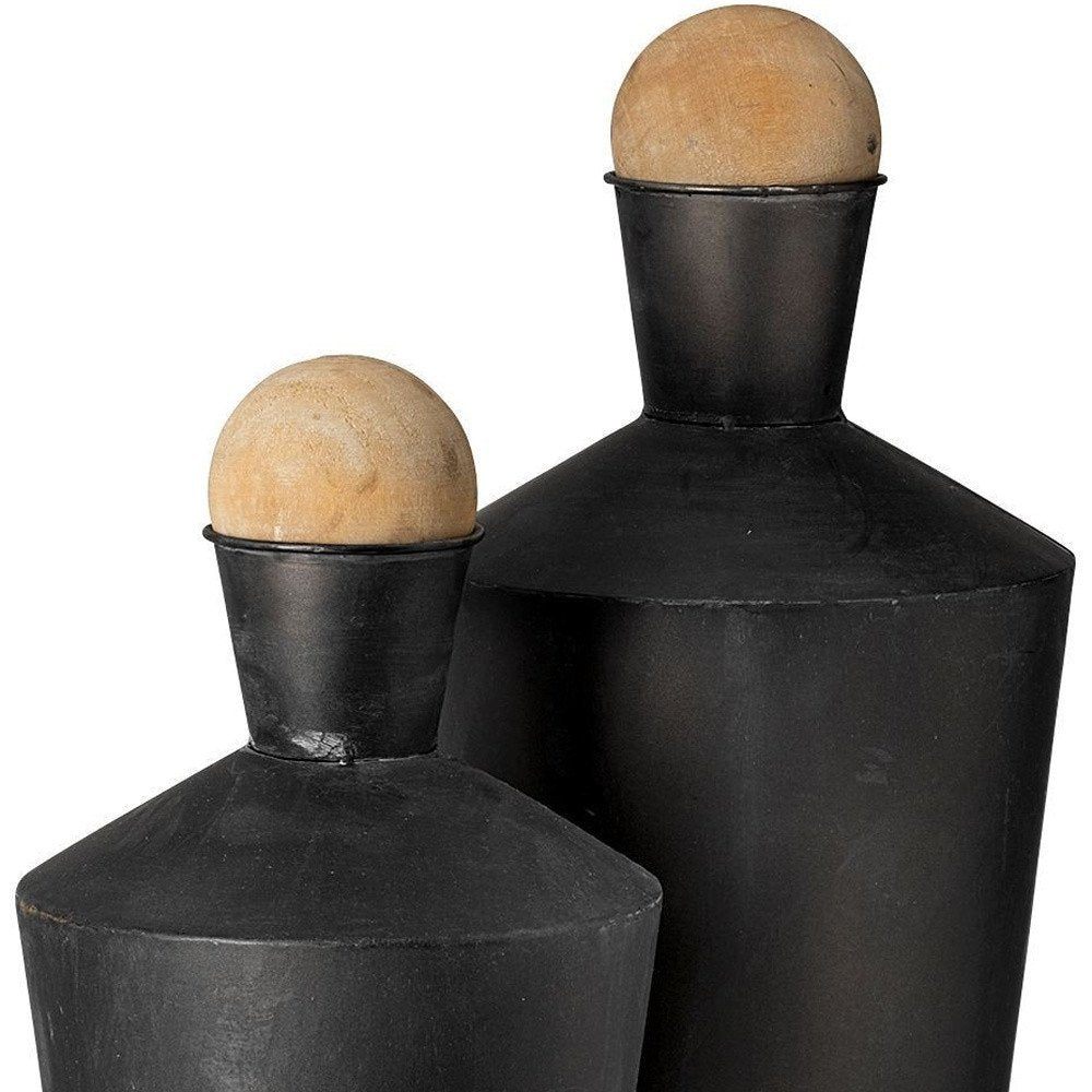 Set of Two Black and Brown Metal Cylindrical Urns on a white background