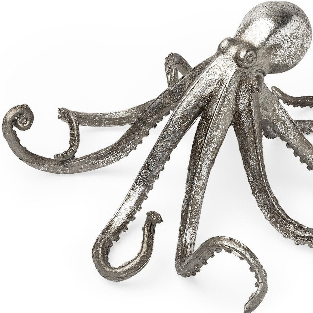 12" Antiqued Silver Resin Octopus Tabletop Sculpture. Sculpture isolated on a plain white background, in a silver resin finish.