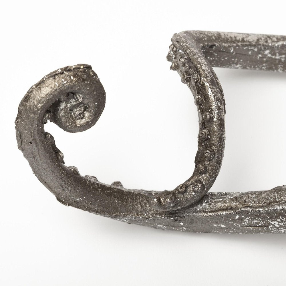 12" Antiqued Silver Resin Octopus Tabletop Sculpture. Sculpture isolated on a plain white background, in a silver resin finish.