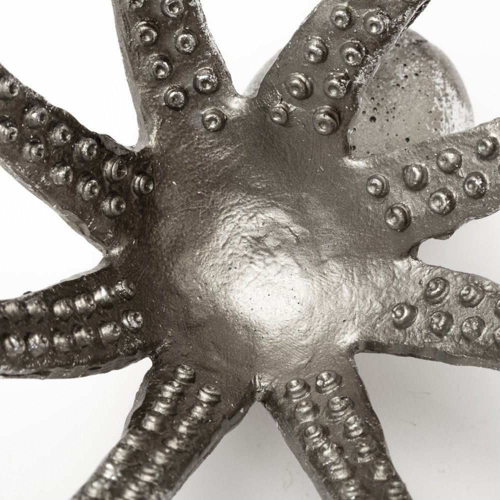 12" Antiqued Silver Resin Octopus Tabletop Sculpture. Sculpture isolated on a plain white background, showing a silver resin surface.