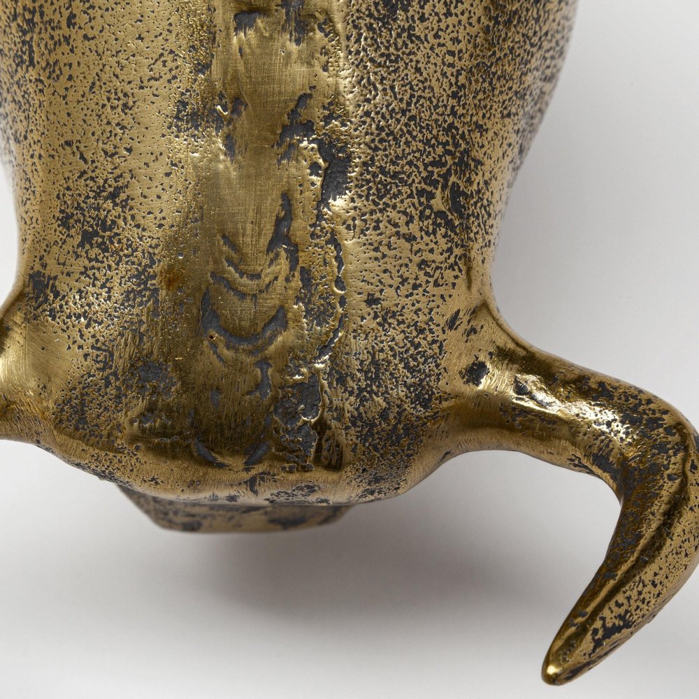 Gold Cast Aluminum Raging Bull Sculpture in a home interior