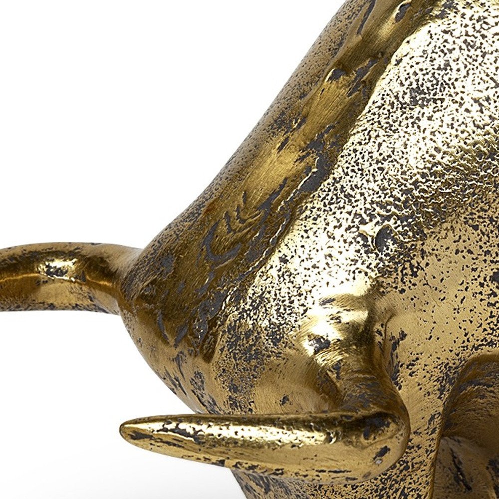 Gold Cast Aluminum Raging Bull Sculpture on a white background