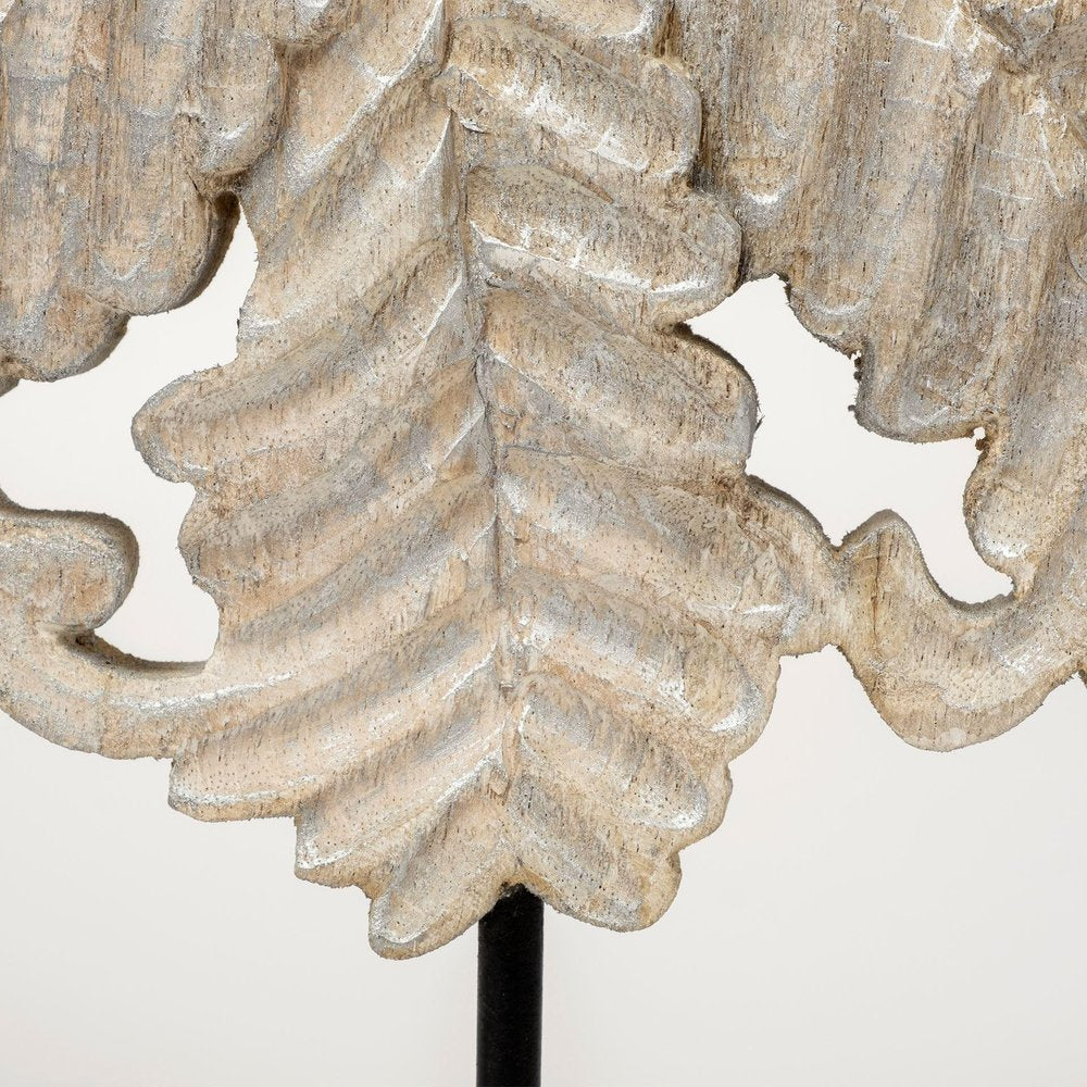 22" White Metal Sculpture styled in a furnished interior with a tan wall on a off-white floor.