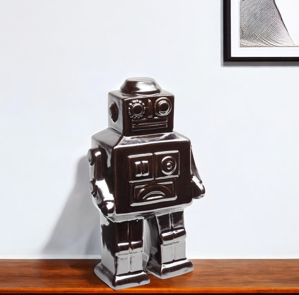 7" Silver Metal Robot Shaped Sculpture on a white background