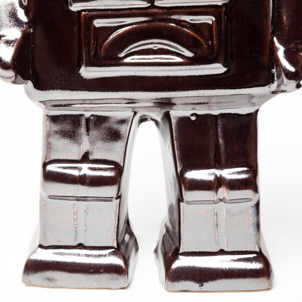 7" Silver Metal Robot Shaped Sculpture on a white background