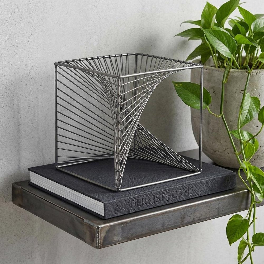 8" Silver Metal Cube Tabletop Sculpture in a home interior
