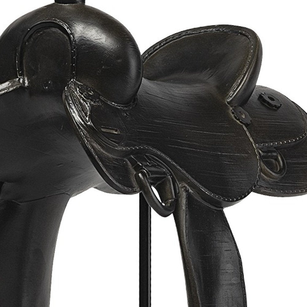 16" Black Metal and Resin Western Horse Saddle Tabletop Sculpture. Sculpture isolated on a plain white background, showing a black metal surface.