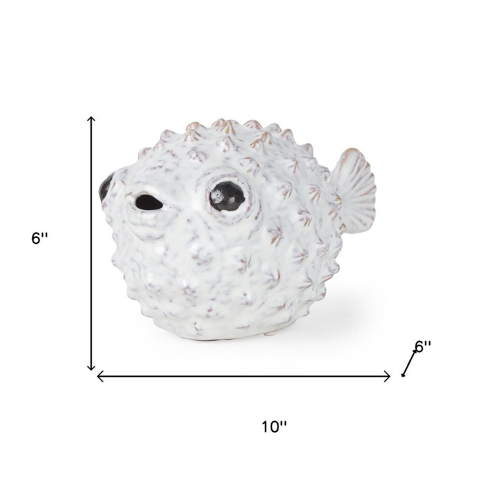 6" White Ceramic Puffer Fish Tabletop Sculpture. Sculpture isolated on a plain white background, in a off-white ceramic finish.