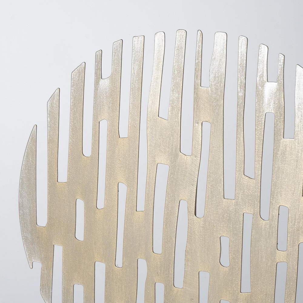Cropped view of 17" Antiqued Gold Round Disc Metal Tabletop Sculpture focusing on the gold metal surface.