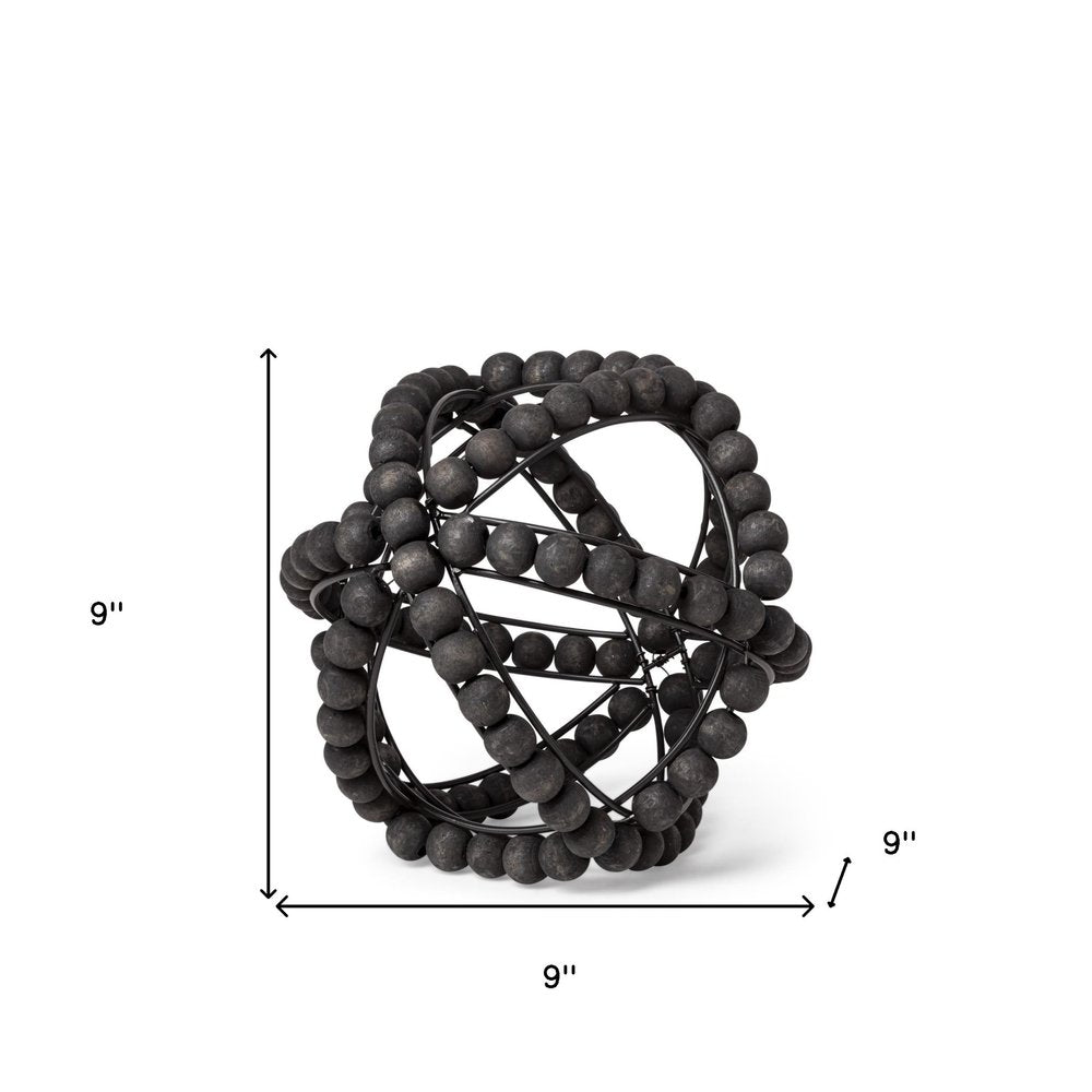9" Black Metal Tabletop Sculpture on a white background