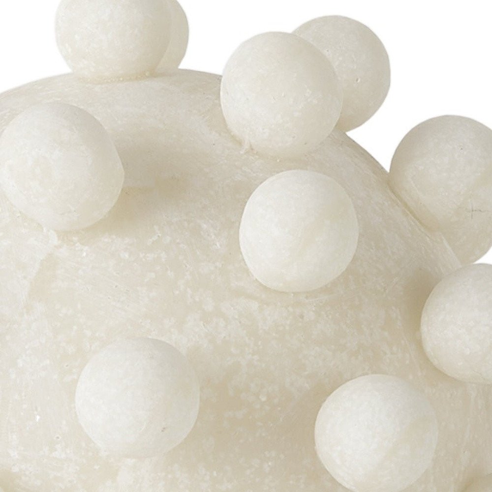 Cropped view of 6" Ivory Resin Knobby Nubs Orb Tabletop Sculpture focusing on the ivory resin surface.