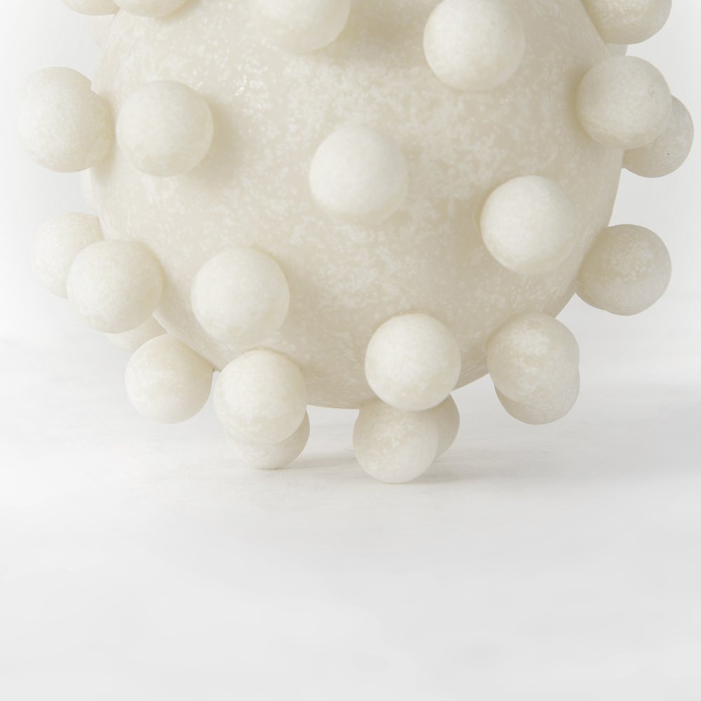 6" Ivory Resin Knobby Nubs Orb Tabletop Sculpture. Sculpture isolated on a plain white background, finished in ivory resin.