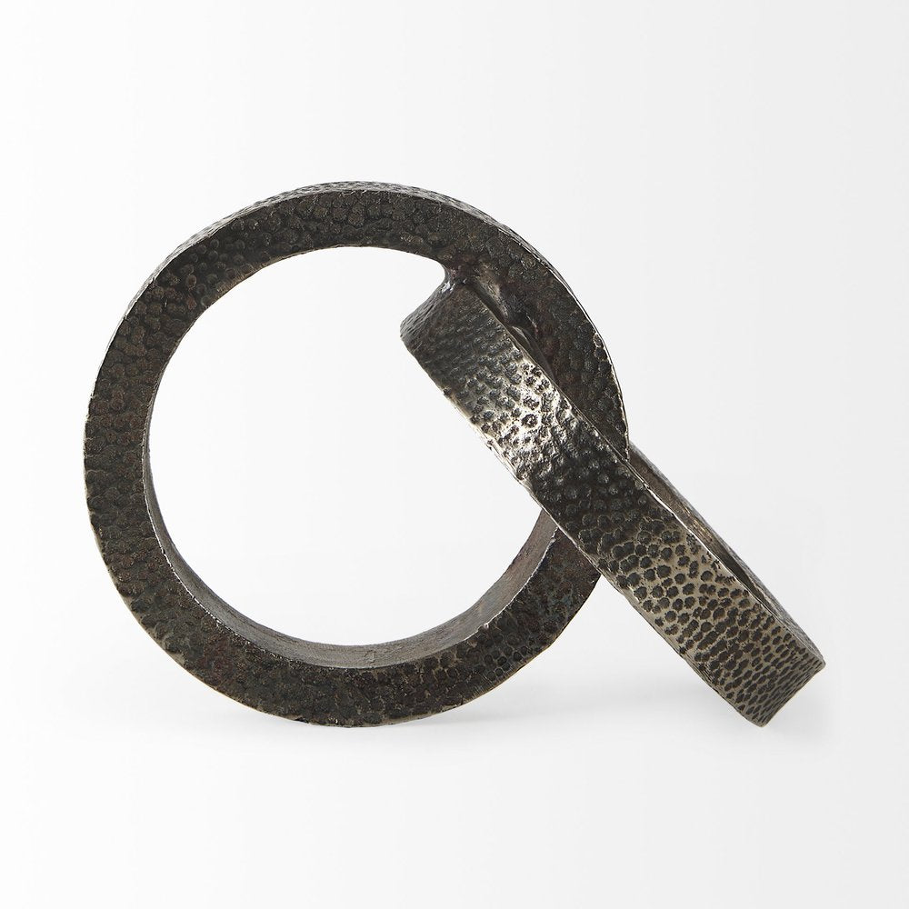 Two Ring Gray Hammered Metal Sculpture on a white background