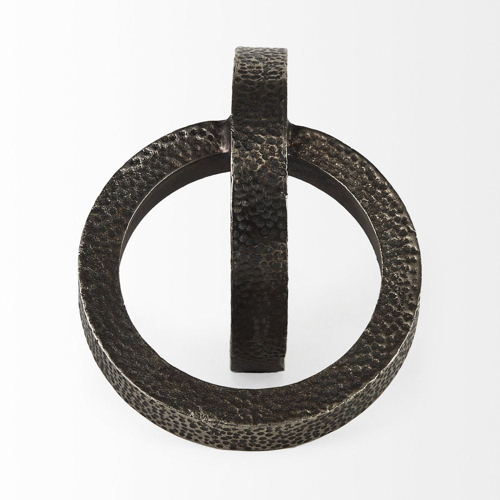 Two Ring Gray Hammered Metal Sculpture on a white background