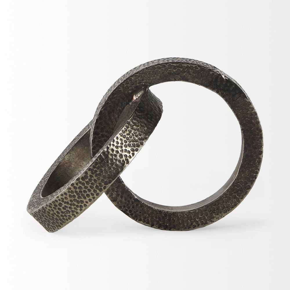 Two Ring Gray Hammered Metal Sculpture on a white background