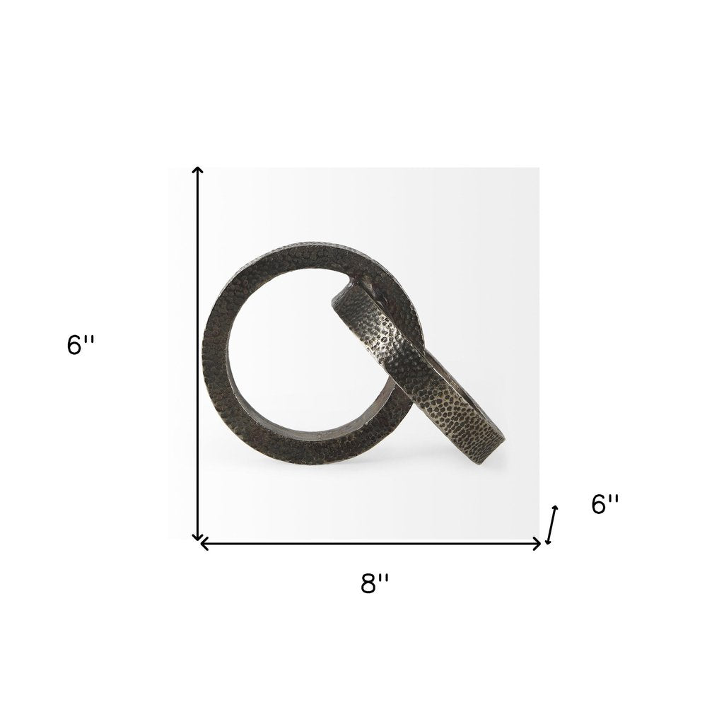 Two Ring Gray Hammered Metal Sculpture on a white background